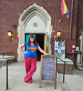 lisa with chalkboard sign